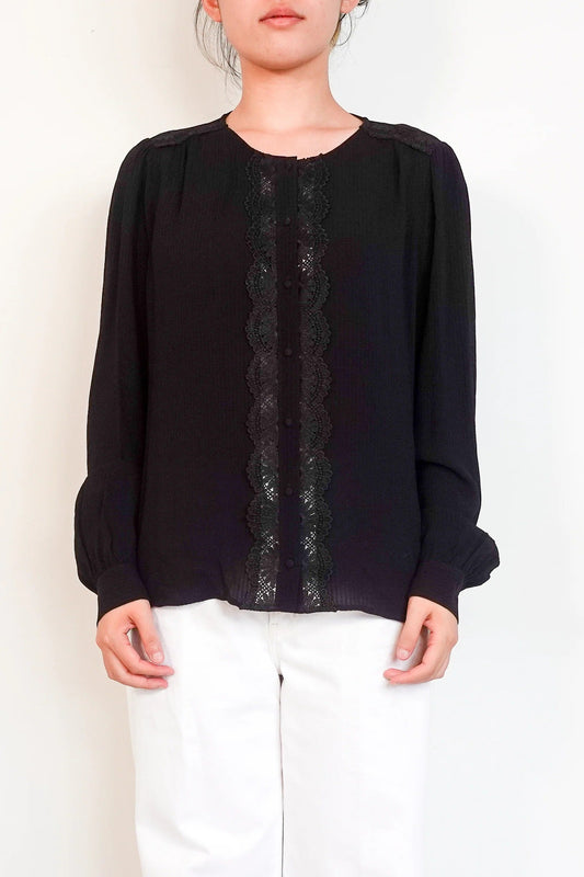 black blouse with embroidered detailing